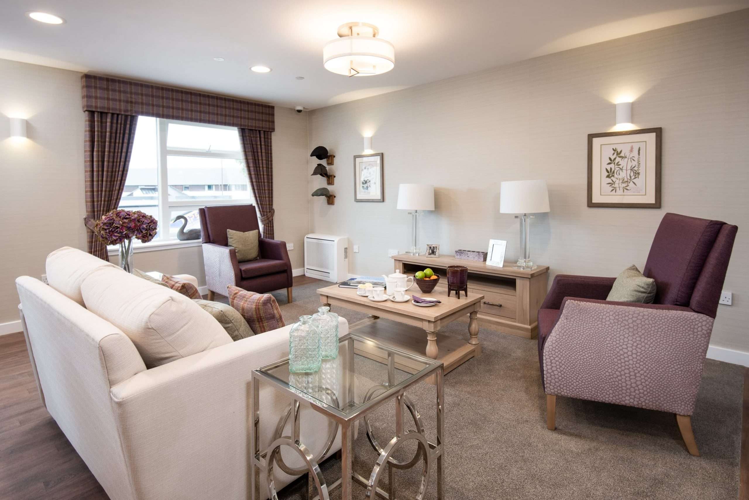 Lounge area with multiple chairs at care home