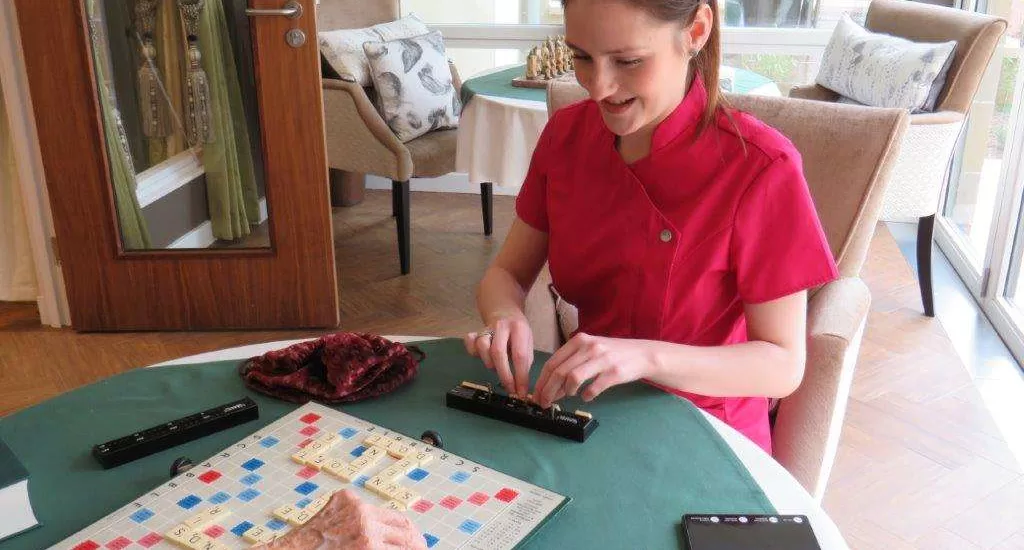 Staff member playing board games